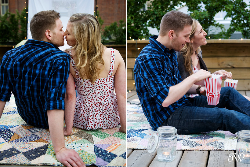 Rooftop-movie-Calgary-engagement-session-couple-eating-popcorn