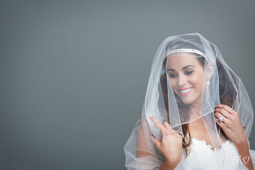 bride smiling in a veil captured by Tara Whittaker Photography