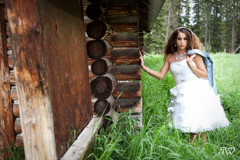 bride at a log cabin captured by Tara Whittaker Photography