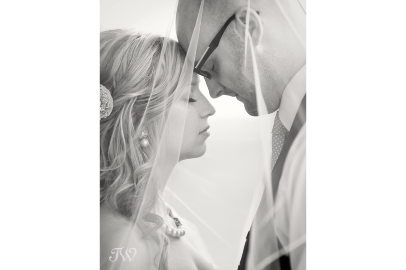 the bride, a groom and a veil captured by Tara Whittaker Photography