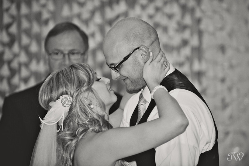 First kiss at a High River Wedding captured by Tara Whittaker Photography