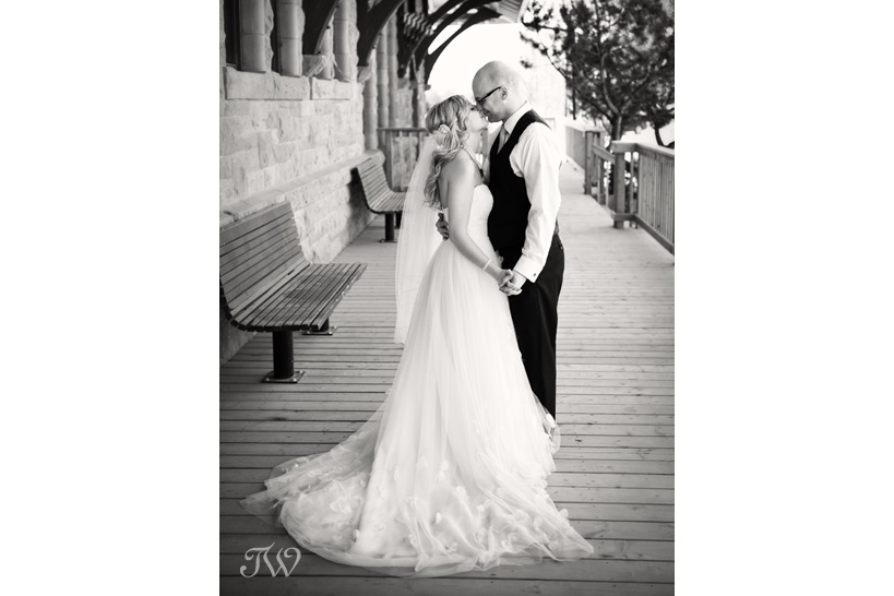 bride and groom kiss before their High River wedding captured by Tara Whittaker Photography
