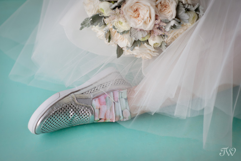 bride in silver wedding sneakers photographed by Tara Whittaker Photography