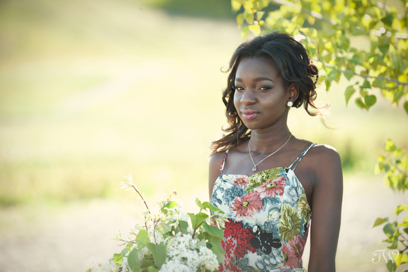 Bridesmaid in a floral print gown captured by Tara Whittaker Photography