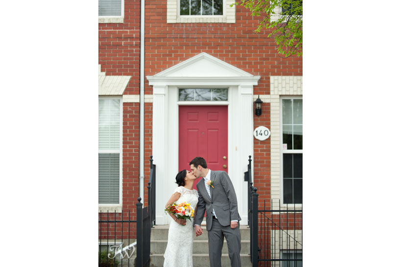 bride and groom kiss at the front door captured by Tara Whittaker Photography