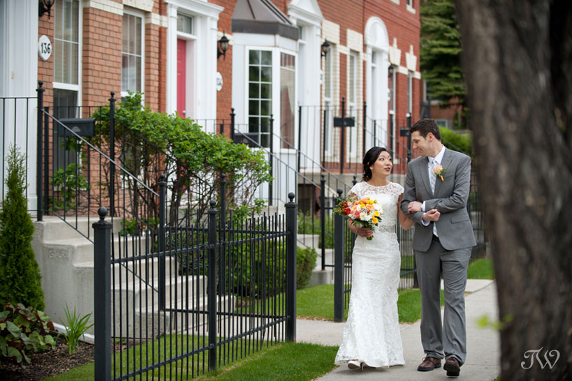 bride and groom stroll to ceremony captured by Tara Whittaker Photography