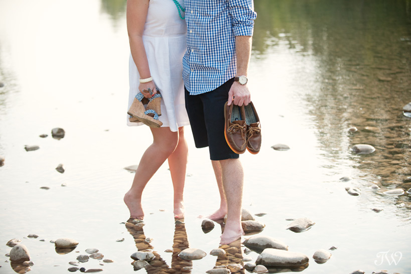 couple wading in the river captured by Tara Whittaker Photography