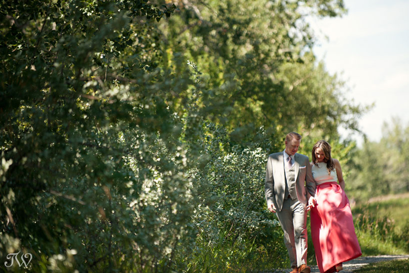 bride and groom take a romantic stroll captured by Tara Whittaker Photography