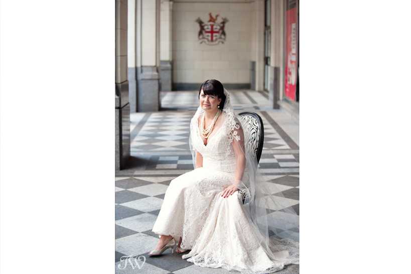 Bride poses on Stephen Avenue captured by Tara Whittaker Photography