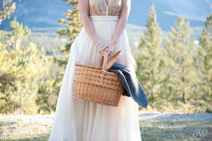 bride holding a picnic basket captured by Tara Whittaker Photography