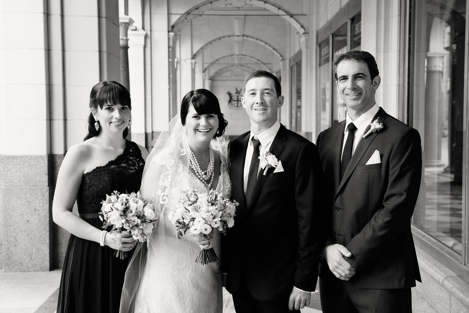 couple with their bridal party on Stephen Avenue captured by Tara Whittaker Photography