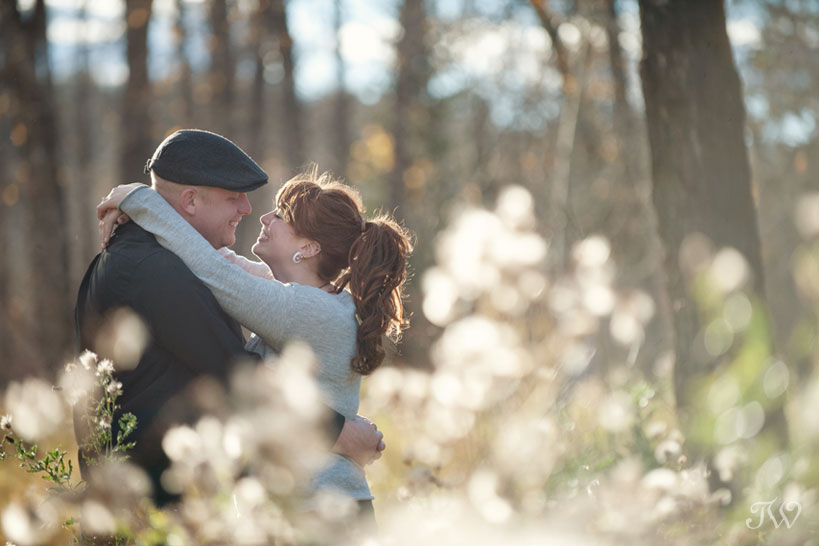 couple during their autumn engagement session in Fish Creek Park with Tara Whittaker Photography