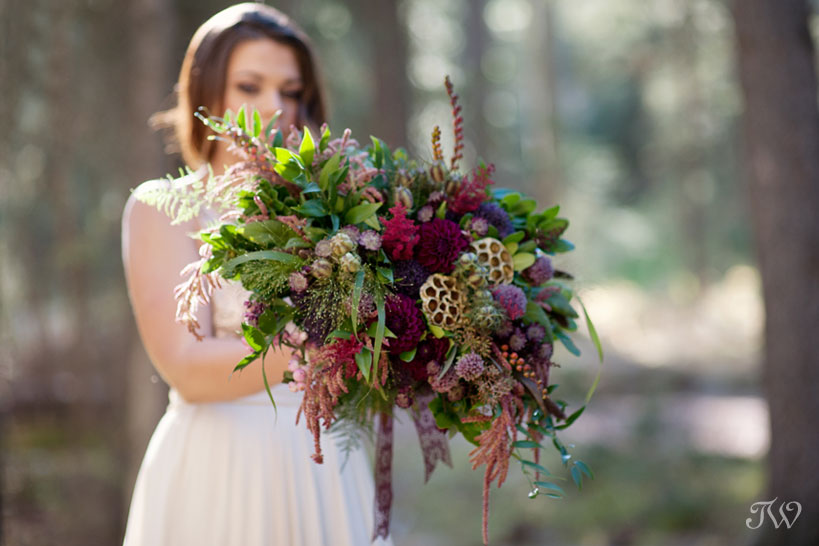 bride holding her autumn wedding bouquet captured by Tara Whittaker Photography