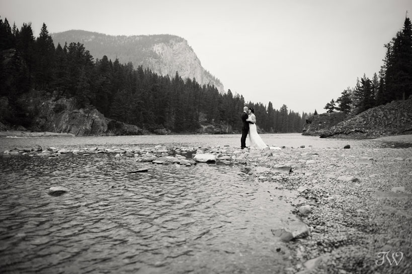 bride and groom at Bow Falls captured by Tara Whittaker Photography