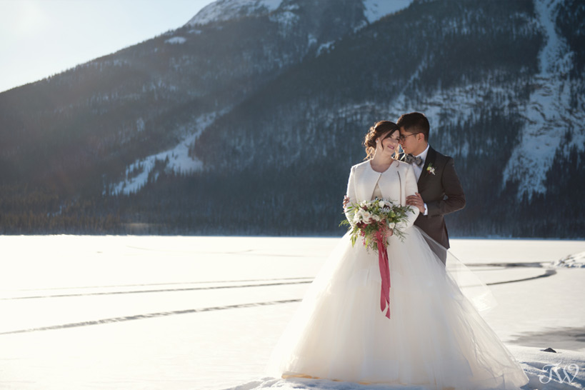 bride and groom at spray lakes captured by Tara Whittaker Photography