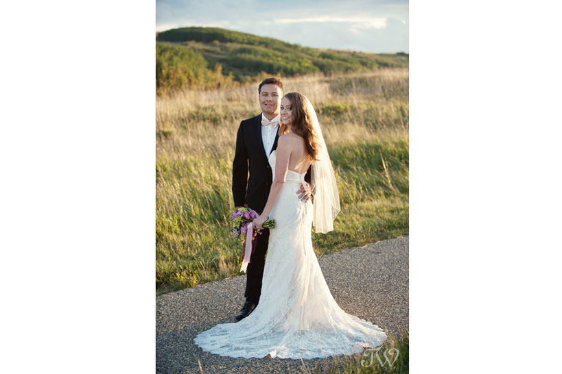 Bride and groom in Nose Hill Park captured by Calgary wedding photographer Tara Whittaker