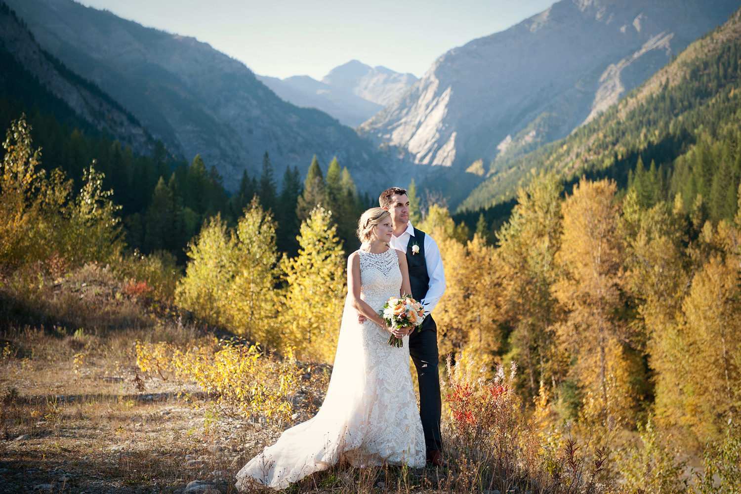 bride and groom pose in the Rockies captured by Tara Whittaker Photography