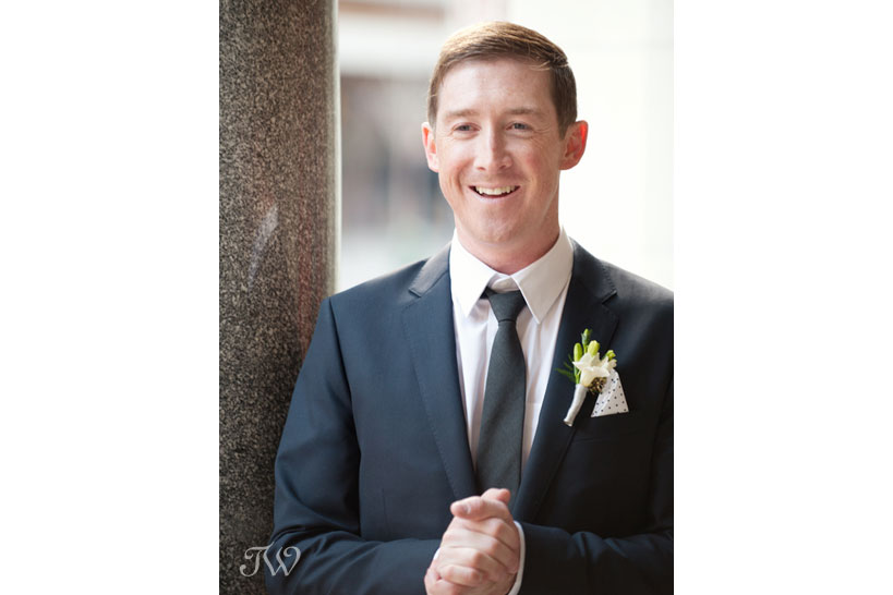 groom on Stephen Avenue captured by Tara Whittaker Photography