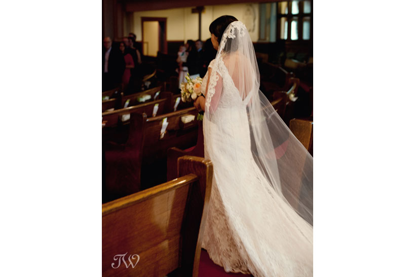 bride walks down the aisle at Central United Church captured by Tara Whittaker Photography