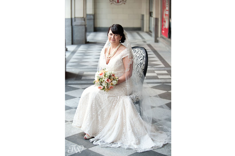 Calgary bride poses on Stephen Avenue captured by Tara Whittaker Photography