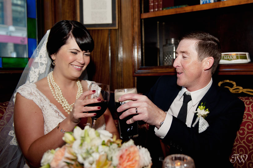 bride and groom life a glass at James Joyce Irish Pub captured by Tara Whittaker Photography