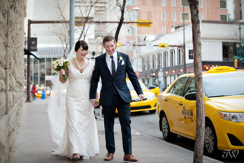 Bride and groom on Stephen Avenue captured by Tara Whittaker Photography