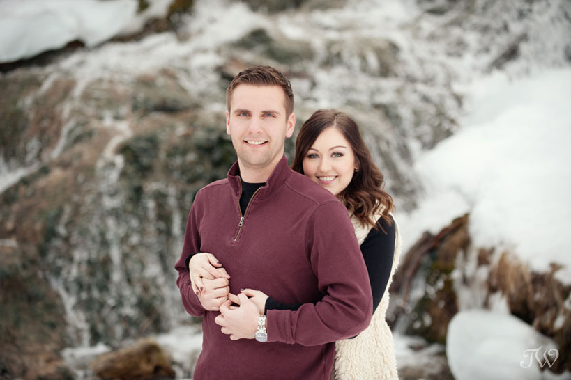 couple pose for winter engagement photos captured by Tara Whittaker Photography