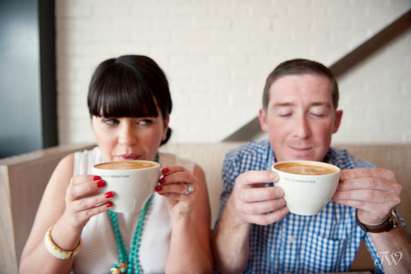 Couple sip coffee during their engagement session at Phil & Sebastian captured by Tara Whittaker Photography