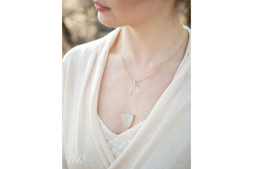 bride wears layered gold necklaces from Adorn Boutique captured by Tara Whittaker Photography
