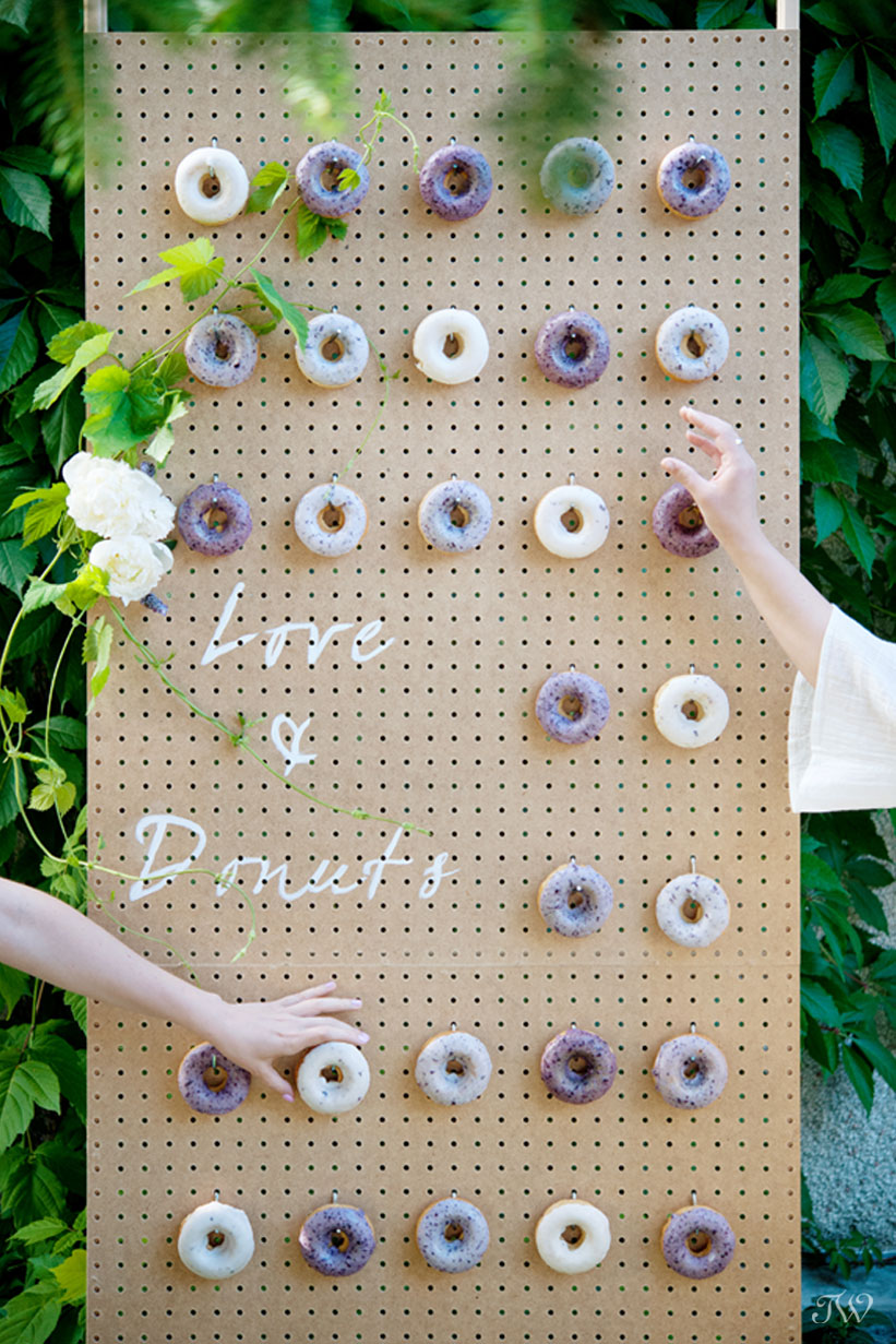 donut wedding favors displayed on a donut wall