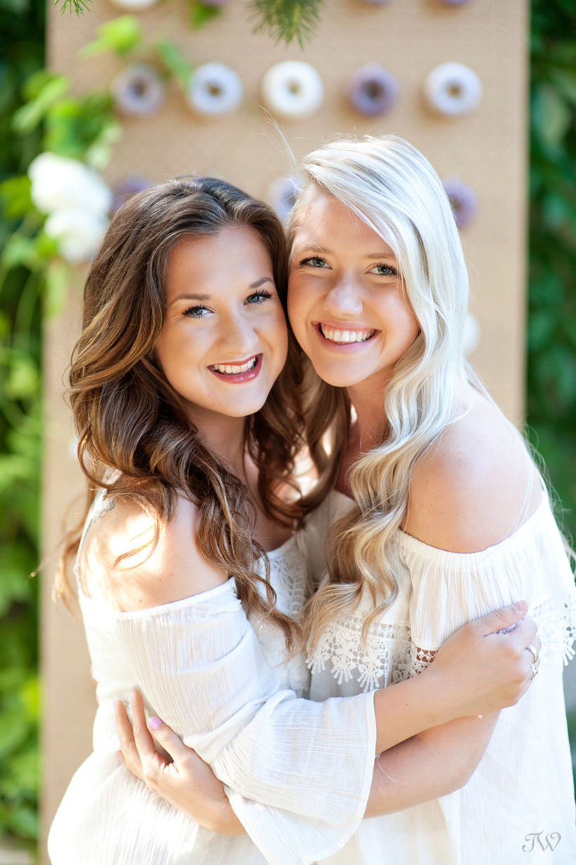 two guests at a backyard bridal shower captured by Calgary wedding photographer Tara Whittaker