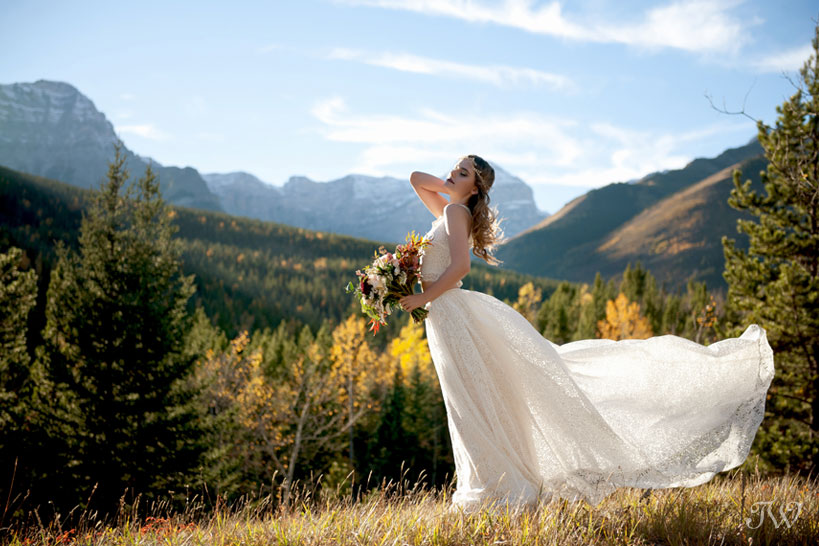 bohemian bride with the Rocky Mountains behind her captured by Tara Whittaker Photography
