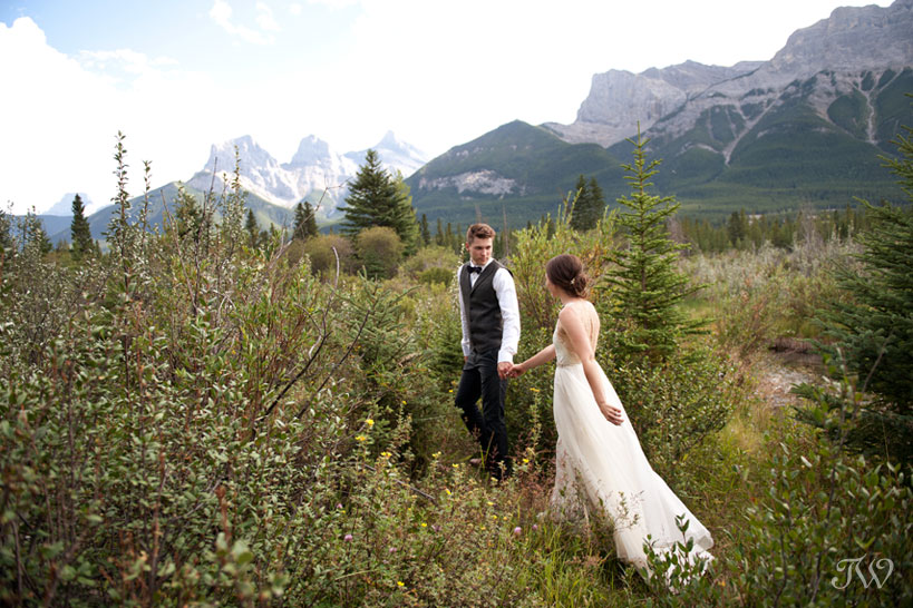 bride and groom near The Three Sisters in Canmore Tara Whittaker Photography