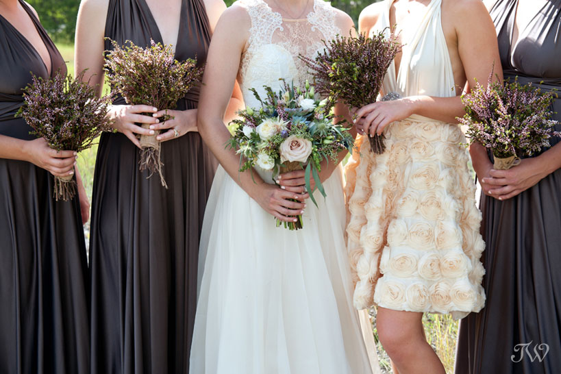 bridesmaids carrying bouquets from Black Earth Floral captured by Calgary wedding photographer Tara Whittaker