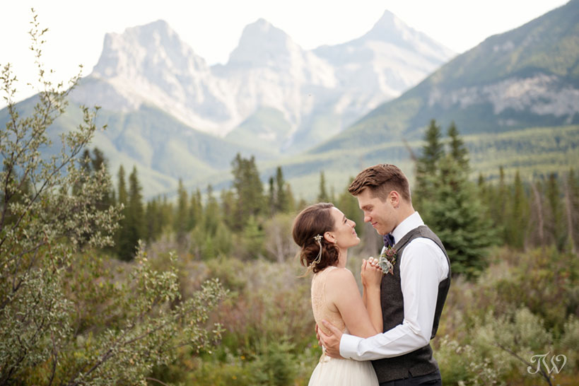 couple in front of The Three Sisters before their Cornerstone Theatre wedding