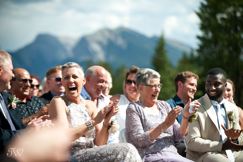 moment of laughter during ceremony captured by Calgary wedding photographer Tara Whittaker