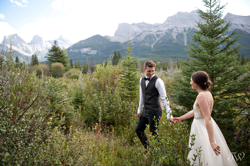 bride and groom near The Three Sisters in Canmore Tara Whittaker Photography
