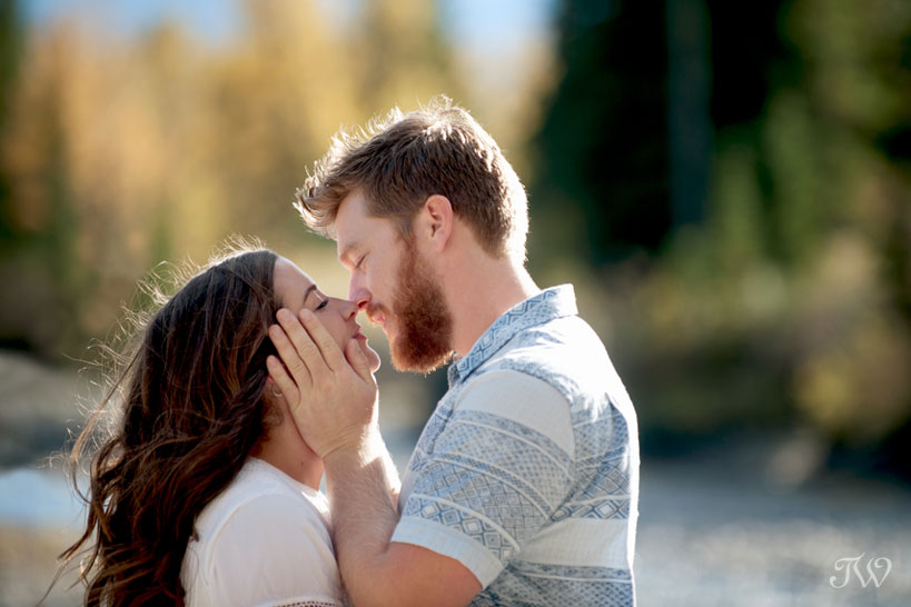 Sweet kiss during a fall engagement session captured by Tara Whittaker Photography