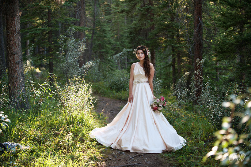 Rocky Mountain bride in the woods captured by Calgary wedding photographer Tara Whittaker