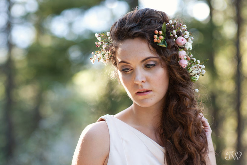 Rocky Mountain bride with flowers in her hair captured by Calgary wedding photographer Tara Whittaker