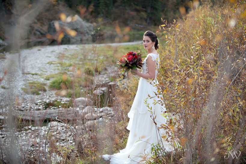 Bride in Fish Creek Park wearing Hayley Paige bridal captured by Calgary wedding photographer Tara Whittaker