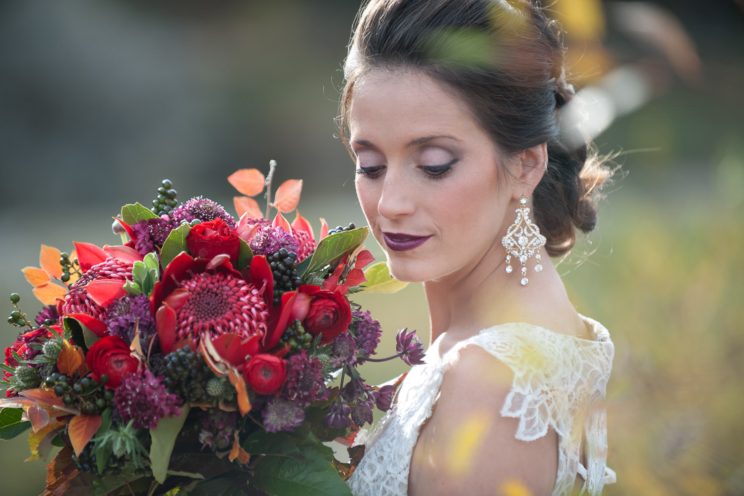 bride with her red bridal bouquet captured by Tara Whittaker Photography
