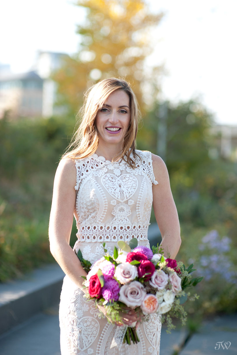 bride carrying bouquet from Flowers by Janie captured by Tara Whittaker Photography