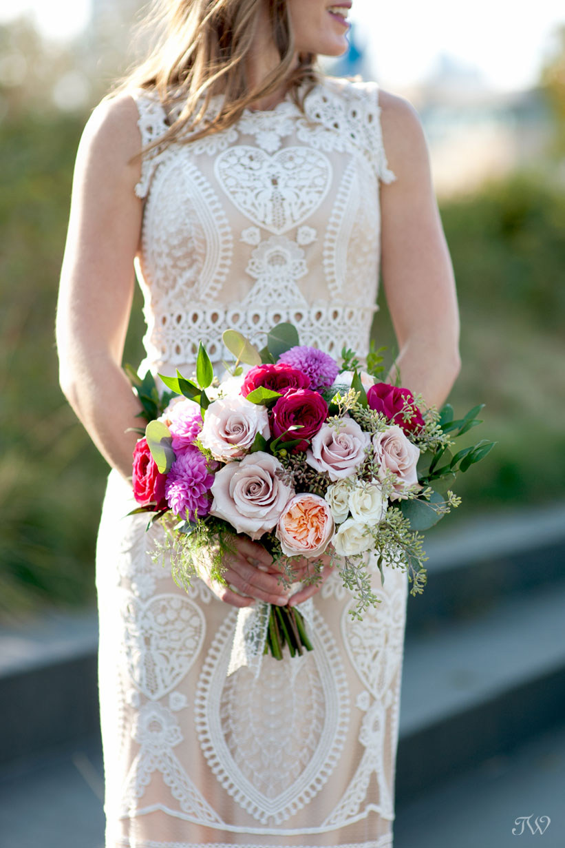bride carries a bouquet from Flowers by Janie captured by Tara Whittaker Photography
