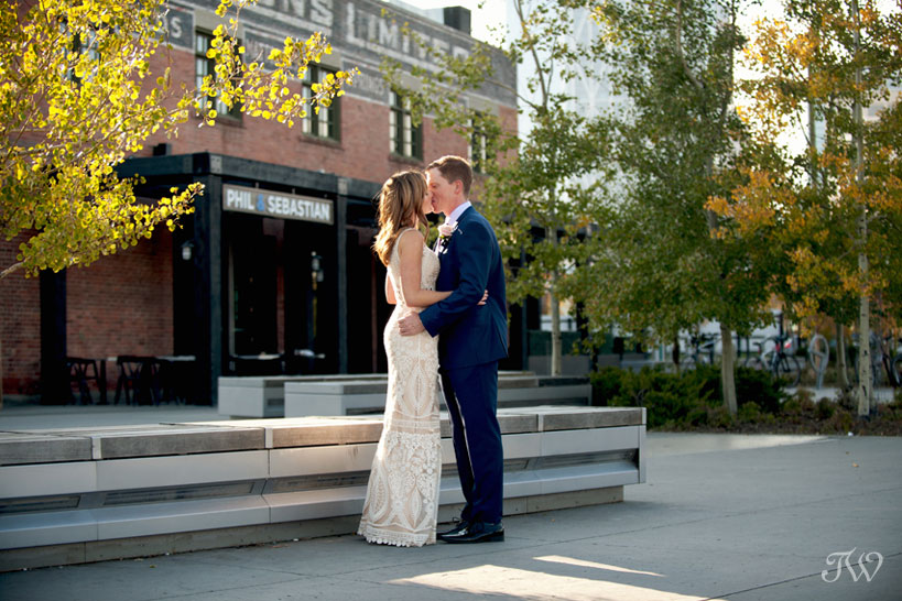 Bride and groom kiss before their Charbar Calgary wedding captured by Tara Whittaker Photography