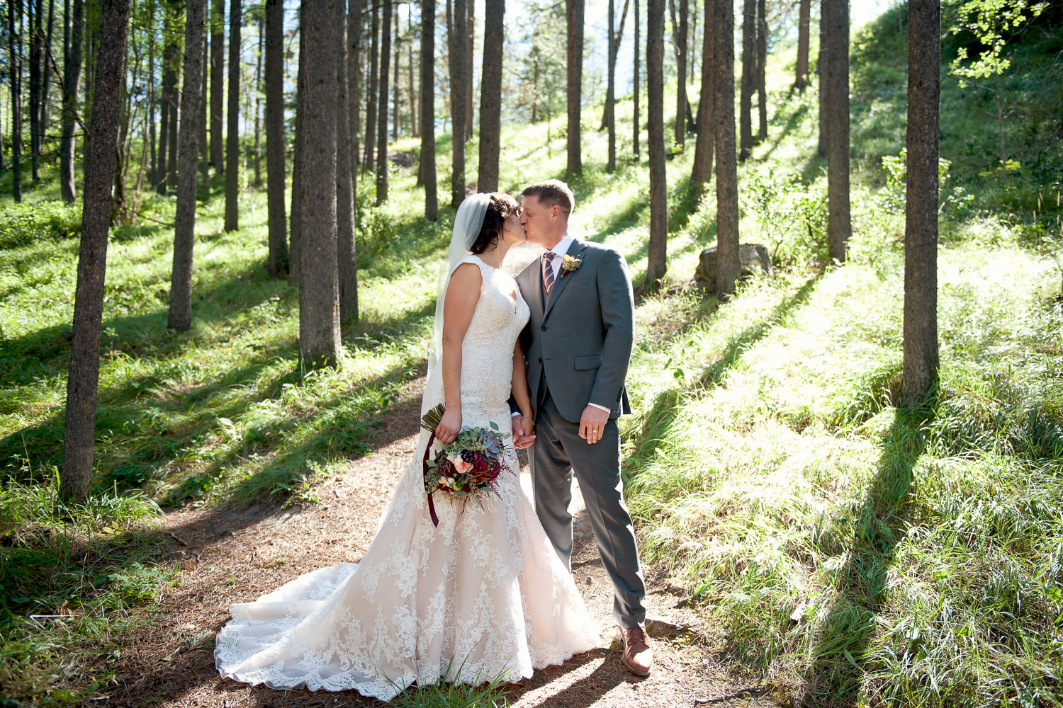 bride and groom kiss after wedding at Quarry Lake captured by Tara Whittaker Photography