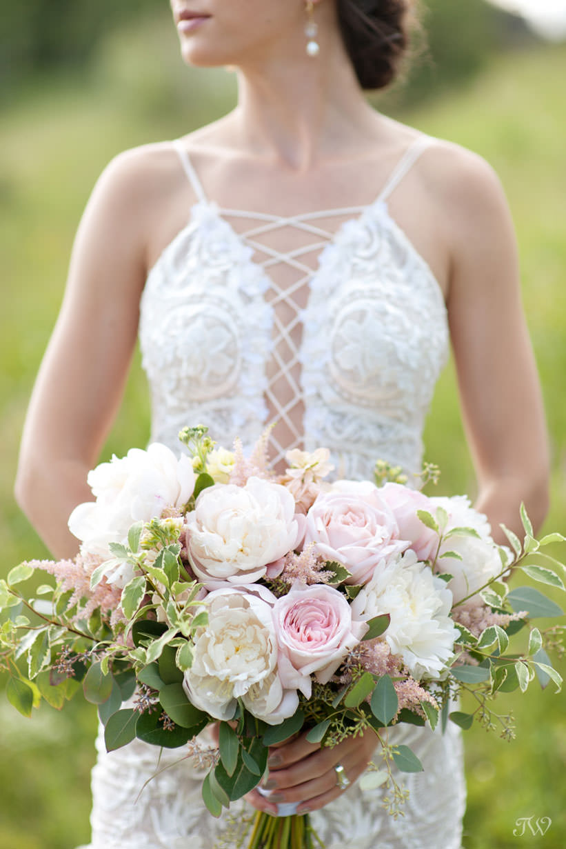 summer bride with a bouquet of peonies from Fleurish Flower Shop captured by Tara Whittaker Photography