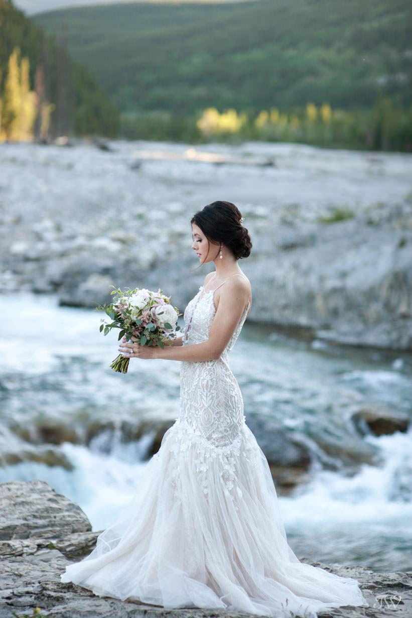 bride at Elbow Falls captured by Calgary wedding photographer Tara Whittaker
