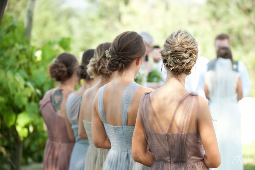 bridesmaids during vineyard wedding ceremony in Kelowna captured by Tara Whittaker Photography