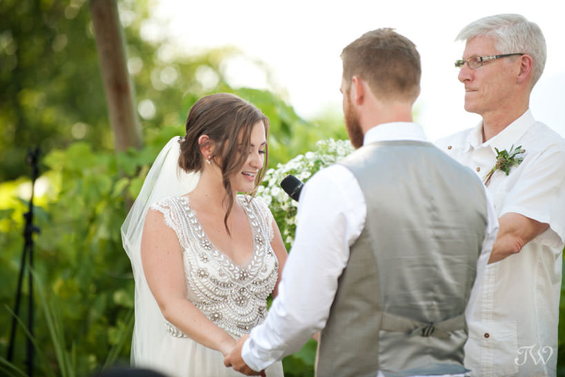 vows during vineyard wedding ceremony in Kelowna captured by Tara Whittaker Photography